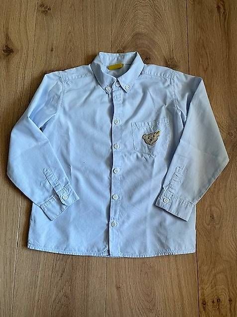Chemises, T-shirts & Polos: Hemd von Steiff in hellblau Gr. 116 – D'occasion à Pfäffikon Sz par alar