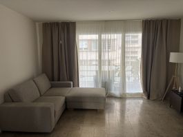 Two seater couch + ottoman with storage