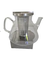 Teekanne aus Glas mit Metallsieb und Stövchen