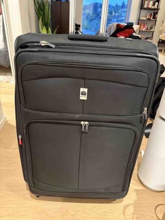 Delsey Suitcase Black Four Wheel luggage XL