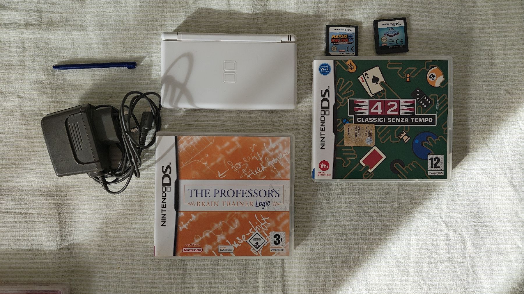 Nintendo DS lite weiss   4xSpiele und Ladekabel AB 1 CHF (Gebraucht) in