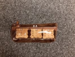 Etui und Stirnband