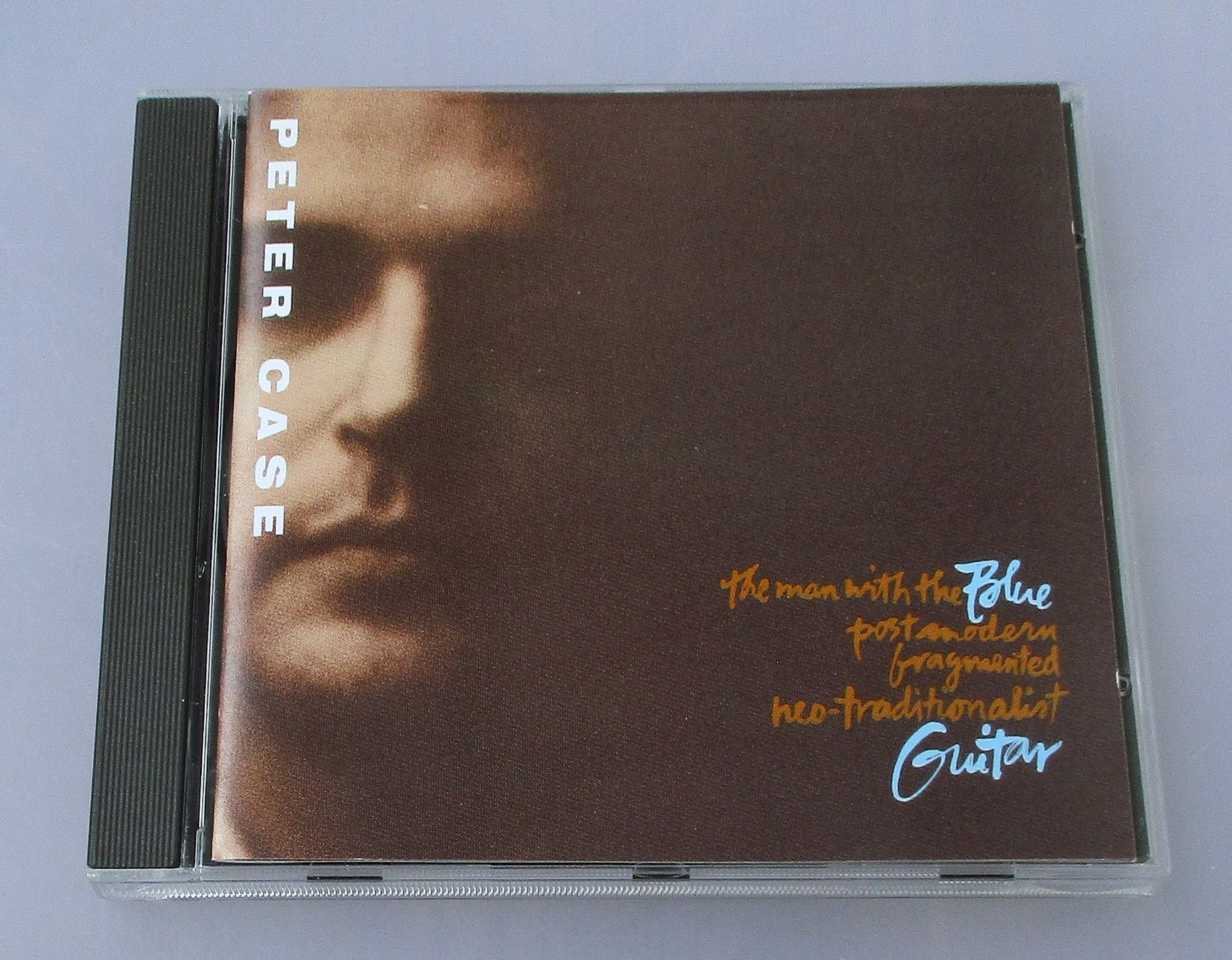 CDs: PETER CASE - The Man With The Blue Postmodern Fragmented... – D'occasion à Wattwil par Muriel11