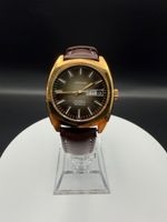 Montre Orano NOS Swiss Automatique day date marron vintage