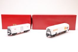 2x Rivarossi Güterwagen Migros und Bell, H0