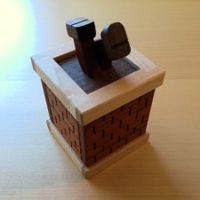 Holz-Puzzlebox Clumsy Santa: Rette Santa aus dem Schornstein