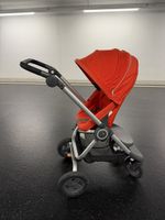 Poussette Stokke rouge orangé 