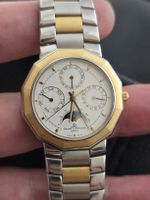 Baume & Mercier or 18k et acier, Montre calendrier complet.