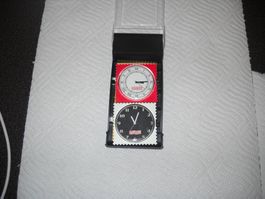 Zwei S.T.A.M.P.S. eine Marke Uhren im Briefmarken-Design