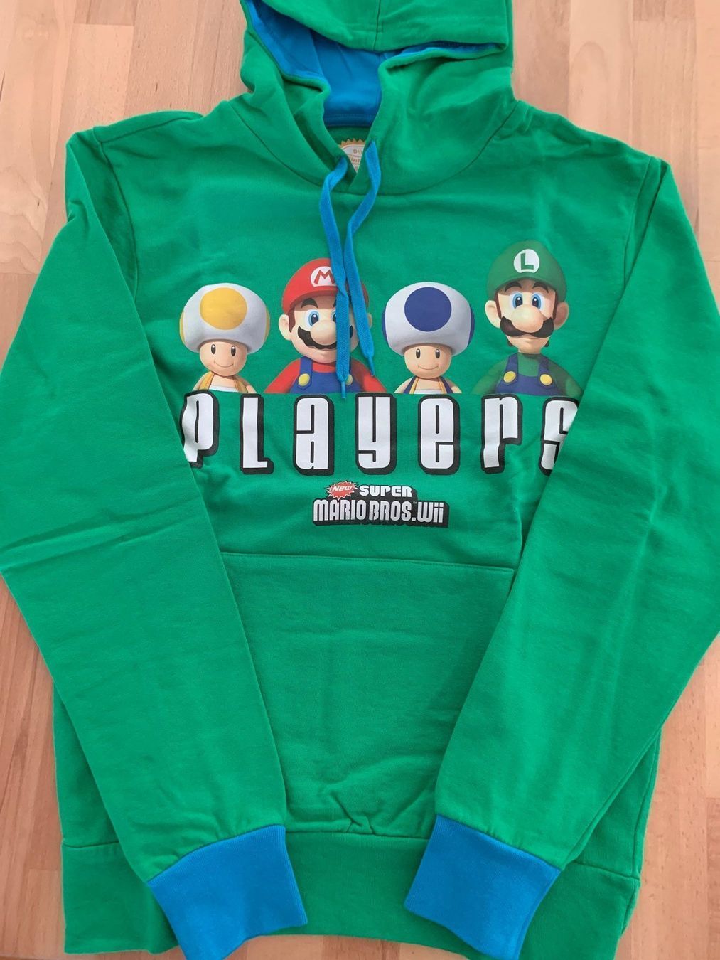 Maglioni & Felpe: Nintendo® Super Mario Bros. Wii Kapuzenpullover Gr. M – Nuovo e nell'imballaggio originale da Wetzikon ZH venduto da EvisStore