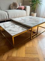Duo de tables basses effet marbre et pieds dorés