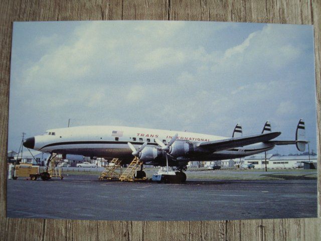 Cartoline postali: Trans International Airlines Lockheed Constellation – Nuovo e nell'imballaggio originale da Thun venduto da Abigboss