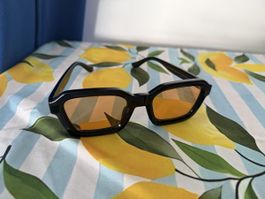 Lunettes de soleil Meller noires verres orangés bon état
