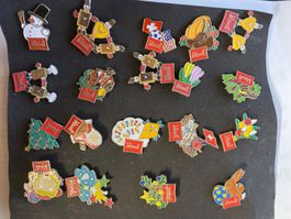19 Pin's "Wernli" thématiques : Suisse, Noël, Pâques, etc..