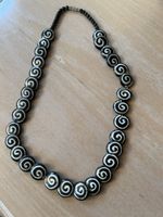 1 collier fantaisie selon photo