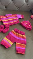 gestrickte Puppenkleider, handarbeit