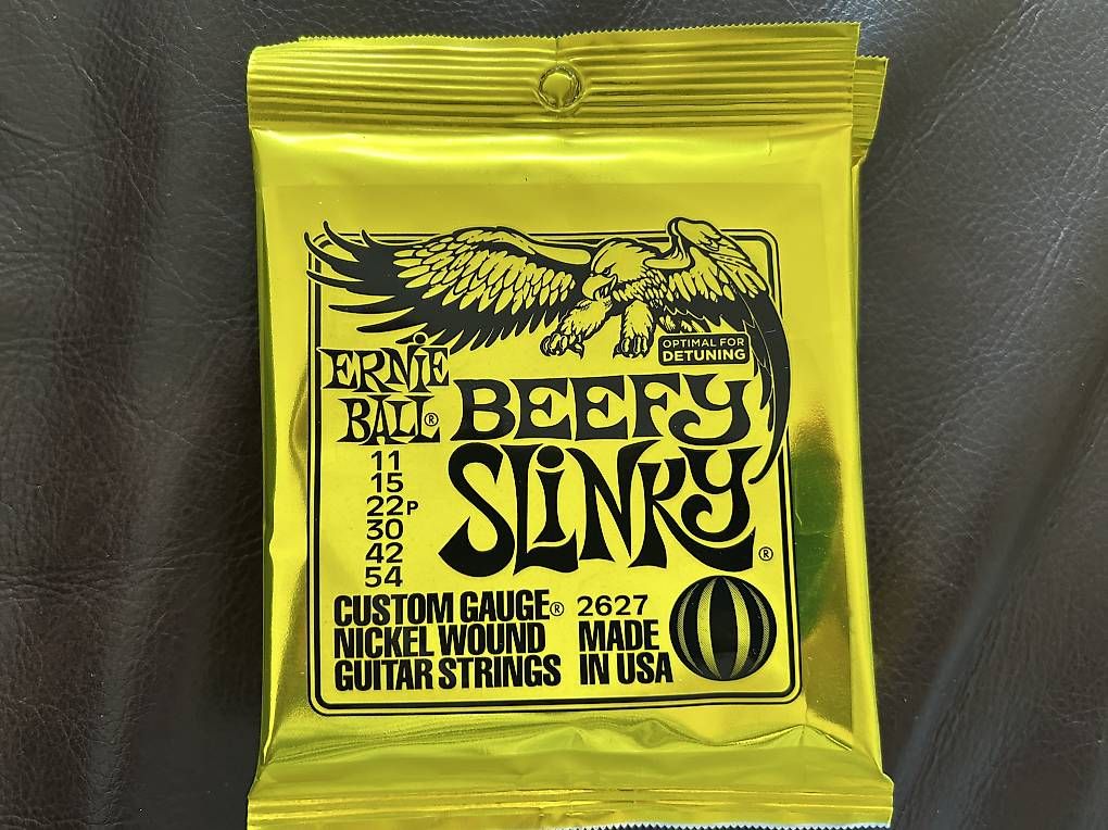 Musikinstrumente: Ernie Ball beefy slinky Saiten – Gebraucht aus Zürich von Sherpa