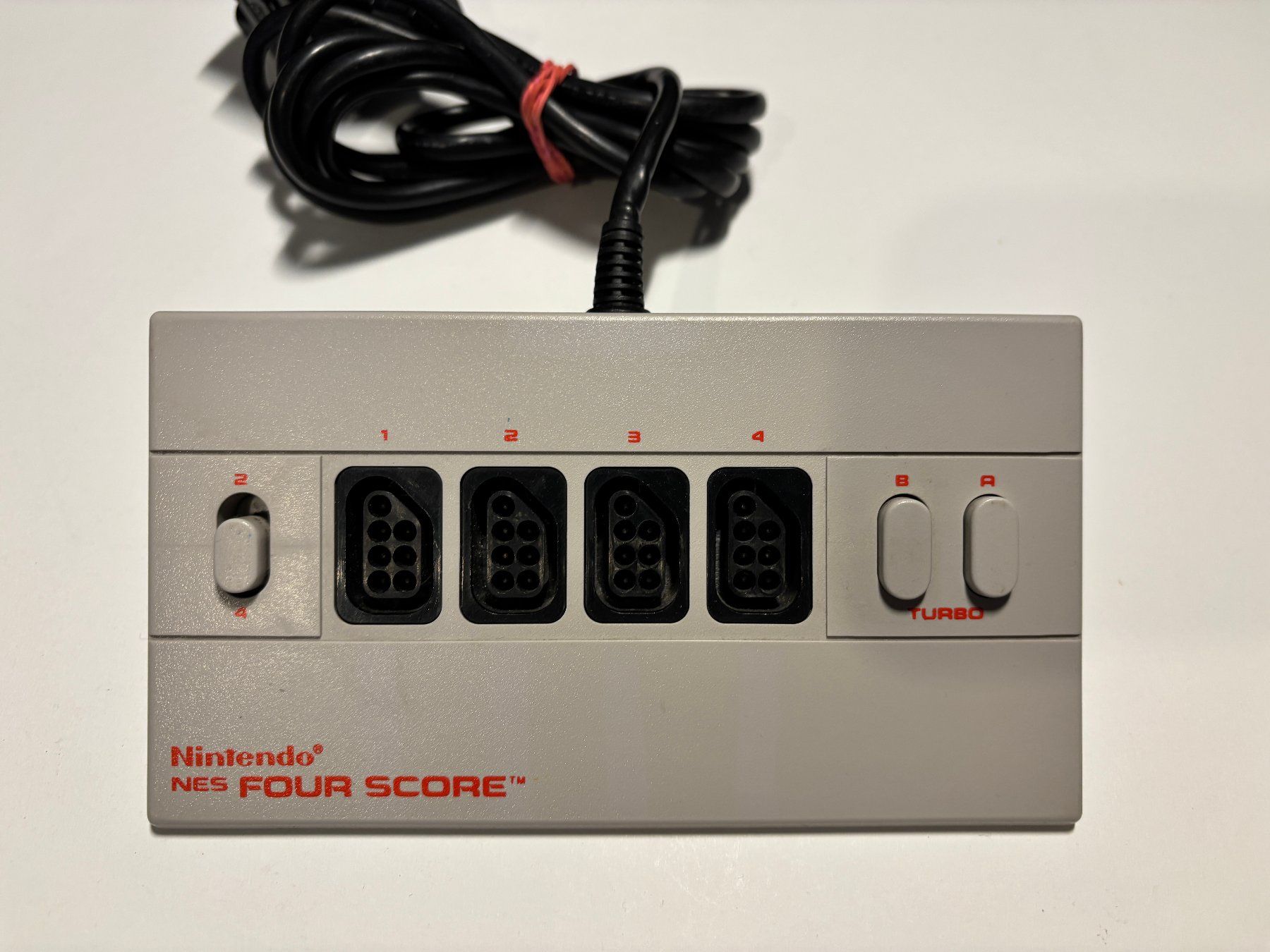 Nintendo Consoles: NES - Four Score Adapter – D'occasion à Allschwil par Bullach