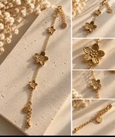 Bracelet en acier inoxydable chaîne doré avec motifs fleurs.