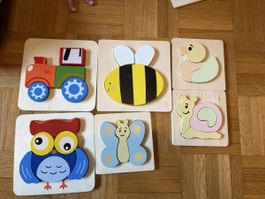 Plusieurs petit puzzle en bois 
