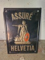 Schild Assuré Helvetia schwarz antik