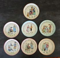 7 Teller mit Schweizer Volksmotiven und Sprüchen