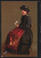 Brigels, Frau in Tracht mit Gänseblumen
