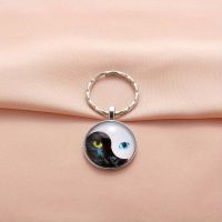 An den Schlüsselanhänger  Tai Yin Yang Katzenkopf