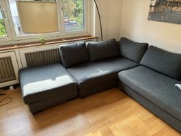 Grosses dunkelgraues Ecksofa mit Ottomane