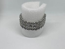Bracciale elastico di bigiotteria a fascia perline argentate