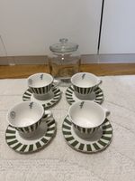 Tassen Set mit Untertassen und Glasbehälter 