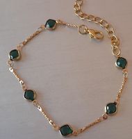 Elegante braccialetto dorato con pietre verdi, come nuovo!