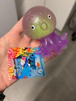 Jouet pieuvre squeeze ball avec paillettes ventouses neuf