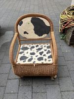 Rattan Sessel mit Kuhfell Muster gebrauchter Zustand