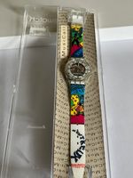 SWATCH MUSICALL SLK 110C FESTIVAL MONTREUX BLUE THROUGH
