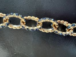 Sautoir doré serti de pierres bleues synthétiques