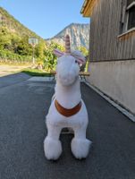 Spielzeug Einhorn weiss mit Sattel und Rädern guter Zustand