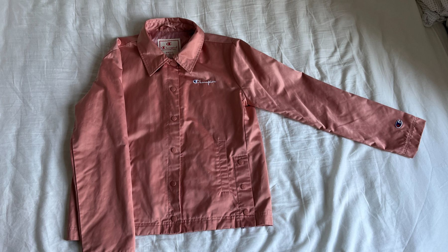 Champion Giacche: Champion Jacke Peach – Usato da Zürich venduto da lau_d8tb