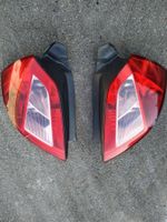 Renault Megane II Heckleuchten links + rechts + Lampenträger