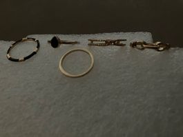 5 goldfarbene Ringe, versch. Grössen und Sujet gem. Foto,neu