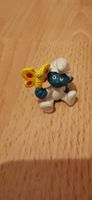 Baby Schlumpf mit Schmetterling