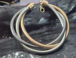 Bracciale rigido color oro e argento 3 fili nuovo