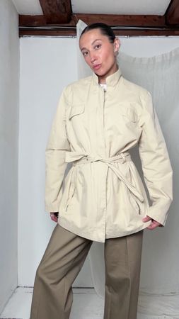 Cream short trench coat with belt