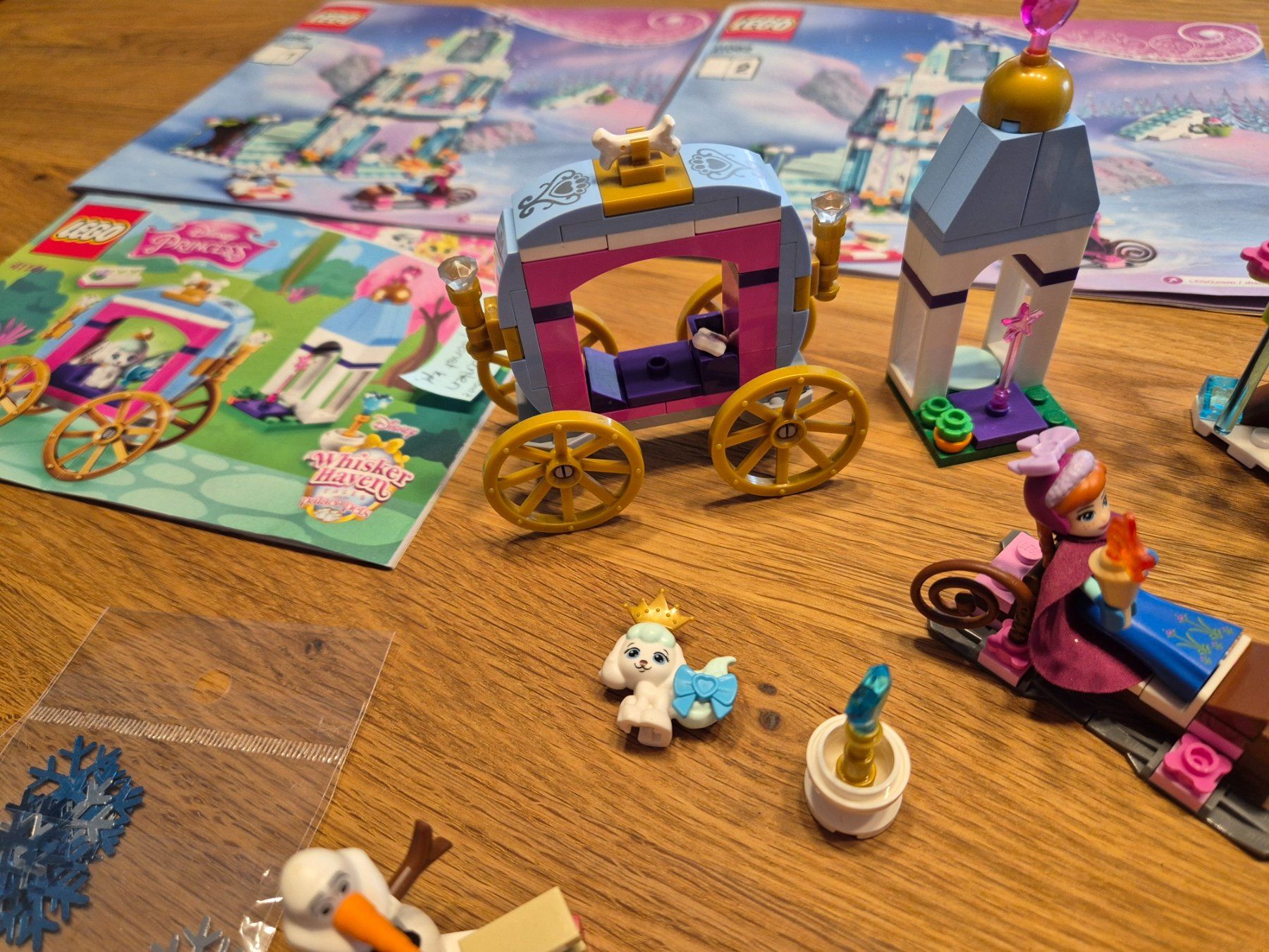 Lego Spielzeuge: Lego Disney Princess 41062 + 41141 Eispalast + Kutsche – Gebraucht aus Leimbach TG von lachende 4