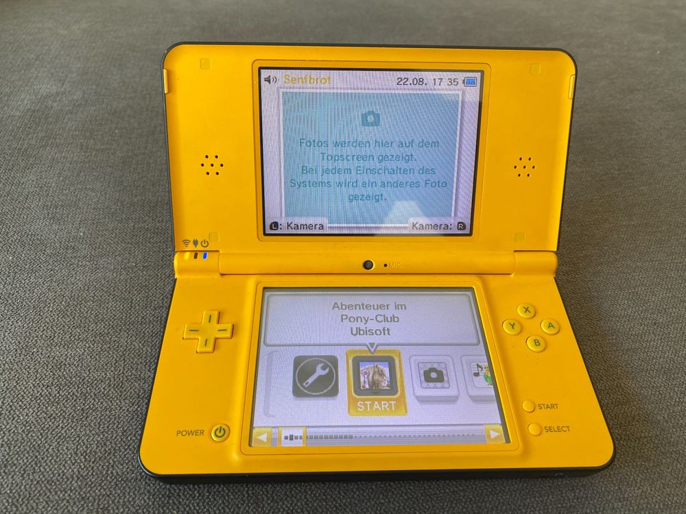 Gelber Nintendo DSi XL inkl. 7 DS Spiele Kaufen auf Ricardo