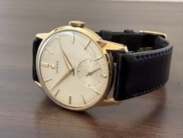 Montre vintage bracelet Omega or 14 carats cadran clair 