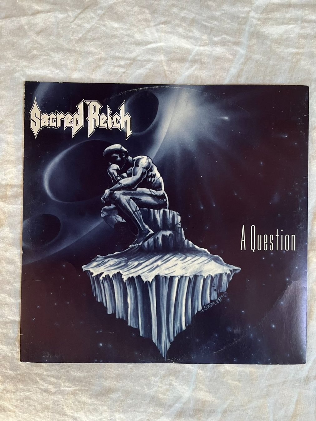 Vinyles: Sacred Reich – A Question vinyl maxi single LP – D'occasion à Effretikon par ChrisLamberger