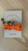 Brillenband der Marke ATTACHED in orange - neuwertig