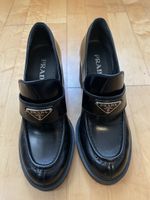 Prada heeled patent leather loafers