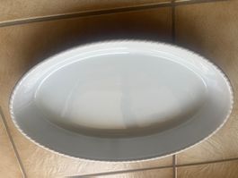 Plat ovale en céramique émaillée marron ancien